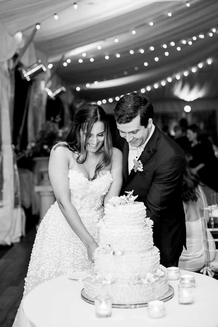 Bride and Groom Cutting the Cake at Gurneys Montauk Wedding Photos