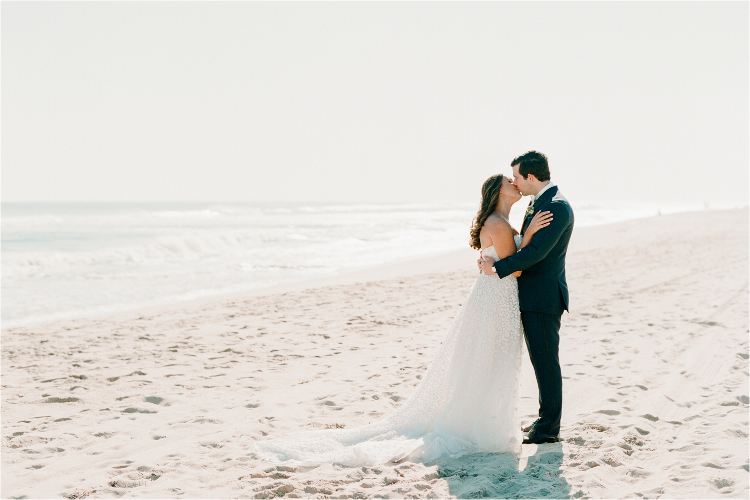 Bride and Groom Kissing on Beach Gurneys Montauk Wedding Photos