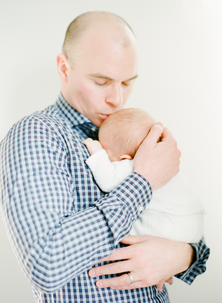 Dad Giving Baby Kisses Newborn Photos